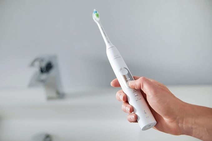 Philips Sonicare ProtectiveClean 6100 Rechargeable Electric Toothbrush with Pressure Sensor 3 Cleaning Modes SmarTimer and QuadPacer 14-Day Battery Life Travel Case Pink Model HX6876/21